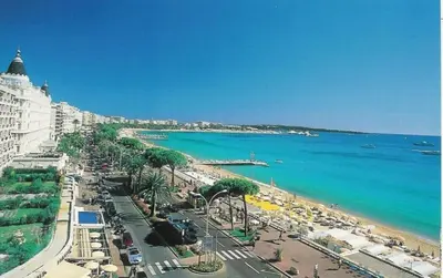 a view of a beach with the ocean and a city at A083 - Modern & Bright apt - Cannes center in Cannes