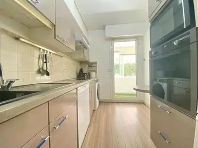 a kitchen with a sink and a stove at Cannes Résidence Passy avec Piscine in Cannes