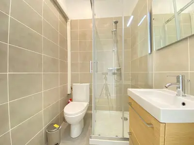a bathroom with a shower and a toilet and a sink at Volupté By SCLS Locations in Cannes