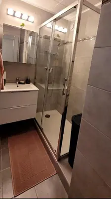a bathroom with a shower and a sink at Appartement proche de la plage in Cannes