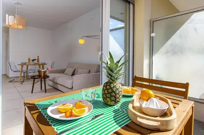 a dining room table with fruit on top of it at Croisette et Plages - Lumineux deux pièces - FW in Cannes
