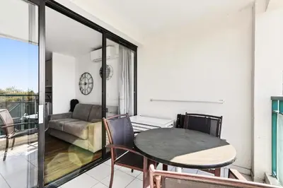 a balcony with a table and chairs and a window at Résidence Cannes Villa Francia - maeva Home - Appartement 2 pièces 4 personnes - Sélection MAE-0091 in Cannes