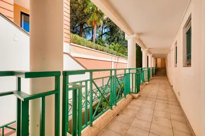 a view of the ocean from a garden at Résidence Cannes Villa Francia - maeva Home - Appartement 2 pièces 4 personnes - Sélection MAE-0091 in Cannes
