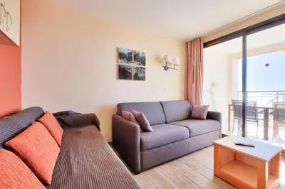 a living room with a couch and a table at Résidence Cannes Villa Francia - maeva Home - Appartement 2 pièces 5 personnes - Prestige MAE-8991 in Cannes