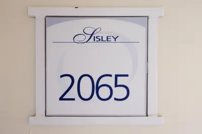 a white sign with the number on it at Résidence Cannes Villa Francia - maeva Home - Appartement 2 pièces 5 personnes - Prestige MAE-8991 in Cannes
