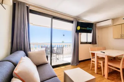a living room with a couch and a table at Résidence Cannes Villa Francia - maeva Home - Appartement 2 pièces 5 personnes - Sélection MAE-9021 in Cannes
