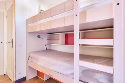a bedroom with bunk beds in a room at Résidence Cannes Villa Francia - maeva Home - Appartement 2 pièces 5 personnes - Sélection MAE-9021 in Cannes