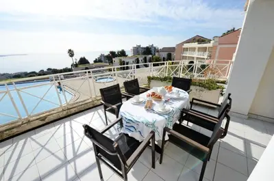 a table and chairs on a balcony with a view at Résidence Cannes Villa Francia - maeva Home - Appartement 2 pièces 5 personnes - Prestige MAE-2341 in Cannes