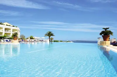 a large pool with blue water in front of a building at Résidence Cannes Villa Francia - maeva Home - Appartement 2 pièces 5 personnes - Prestige MAE-2341 in Cannes