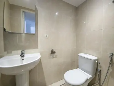 a bathroom with a white toilet and a sink at A022 Chic Cannes Flat Balcony Parking in Cannes