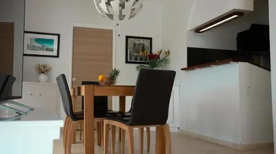 a dining room with a table and chairs at Superbe Villa-Appartement sur la Croisette avec grande terrasse in Cannes