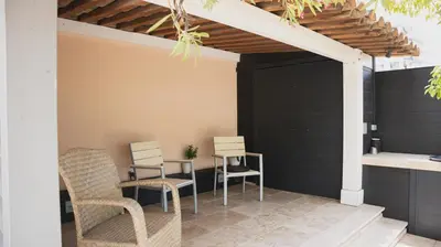 a patio with two chairs and a table at Superbe Villa-Appartement sur la Croisette avec grande terrasse in Cannes