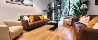 a living room with two couches and a table at Villa Le Loft by Festif Azur 4-Star 200m2 House with Garden, 5-Min Walk to Palais des Festivals and Beaches in Cannes