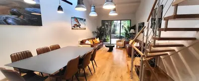 a dining room with a table and chairs at Villa Le Loft by Festif Azur 4-Star 200m2 House with Garden, 5-Min Walk to Palais des Festivals and Beaches in Cannes