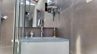 a bathroom with a sink and a mirror at Villa Le Loft by Festif Azur 4-Star 200m2 House with Garden, 5-Min Walk to Palais des Festivals and Beaches in Cannes