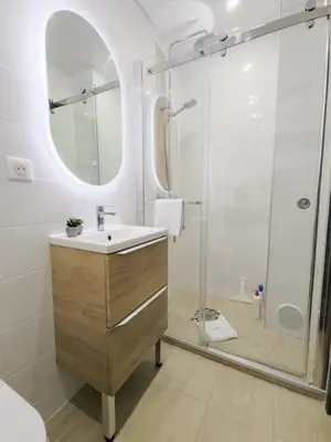 a bathroom with a sink and a shower at Cannes, Sea View, Beach Access, 3-Bedroom Apartment, 100 m2, 3 Bathrooms, Sleeps 6, 100 meters from Beach in Cannes