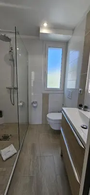 a bathroom with a shower and a toilet and a sink at Cannes, Sea View, Beach Access, 3-Bedroom Apartment, 100 m2, 3 Bathrooms, Sleeps 6, 100 meters from Beach in Cannes