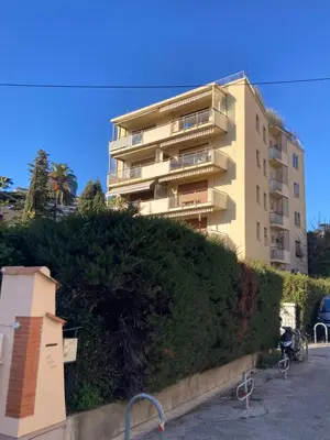 a tall apartment building with a hedge in front of it at Cannes, Sea View, Beach Access, 3-Bedroom Apartment, 100 m2, 3 Bathrooms, Sleeps 6, 100 meters from Beach in Cannes