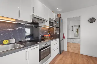 a kitchen with white cabinets and stainless steel appliances at Cannes, Sea View, Beach Access, 3-Bedroom Apartment, 100 m2, 3 Bathrooms, Sleeps 6, 100 meters from Beach in Cannes