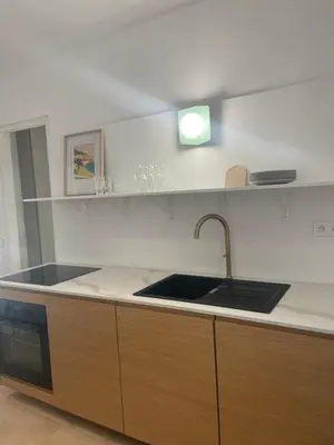 a kitchen with a sink and a counter top at La maison by Simone T3 in Cannes