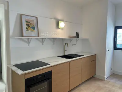 a kitchen with a sink and a counter top at La maison by Simone T3 in Cannes