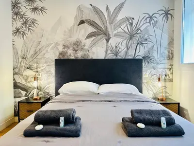 a bedroom with a bed with two pillows on it at Modern and renovated apartments next to the CROISETTE and PALAIS DES FESTIVALS in Cannes