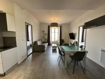 two beds in a room with a window at B081 - Bel appartement Cannes - Tassigny in Cannes