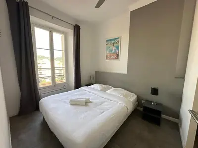 a kitchen and living room with a couch and a table at B081 - Bel appartement Cannes - Tassigny in Cannes