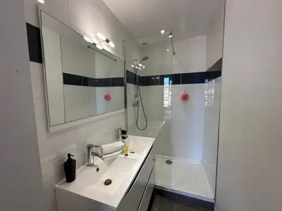 a kitchen and living room with a table and chairs at B081 - Bel appartement Cannes - Tassigny in Cannes