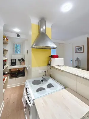 a kitchen with a stove top oven in a kitchen at Les Fleurs in Cannes
