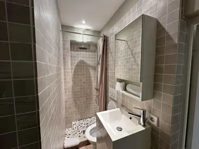 a bathroom with a sink and a shower and a toilet at C025 Villa Toscane Bel Appartement Bourgeois in Cannes