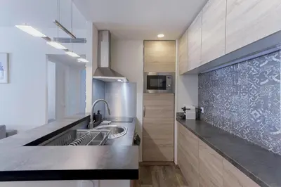 a kitchen with a sink and a counter at Amandier du Moure Rouge in Cannes