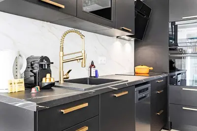 a kitchen with a sink and a stainless steel counter at SUNBLUE - Accommodation Center Cannes & port in Cannes