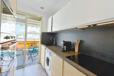 a kitchen with a washer and dryer on the counter at Renovated 1Br apartment terrace walk to beach in Cannes