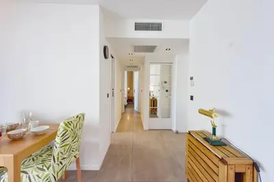 a dining room with a wooden table and a dining room at Renovated 1Br apartment terrace walk to beach in Cannes