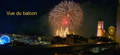 a fireworks display over a city at night at Cannes centre Lou Souquetan in Cannes