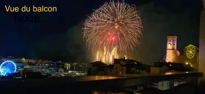 a fireworks display over a city at night at Cannes centre Lou Souquetan in Cannes