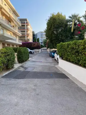 an empty parking lot with parked cars in a building at Appartement vue panoramique sur Cannes, 100M2 3P in Cannes