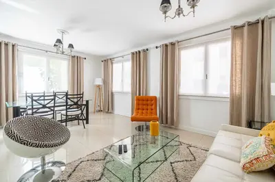 a living room with a couch and a table at Cosy 2-Bedroom apartment - close to Martinez Hotel in Cannes