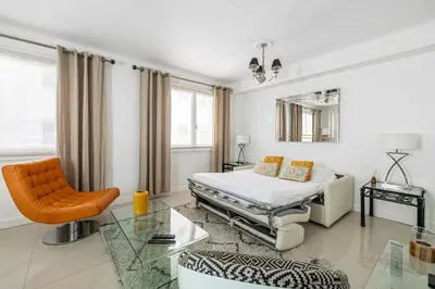 a bedroom with a bed and a glass table at Cosy 2-Bedroom apartment - close to Martinez Hotel in Cannes