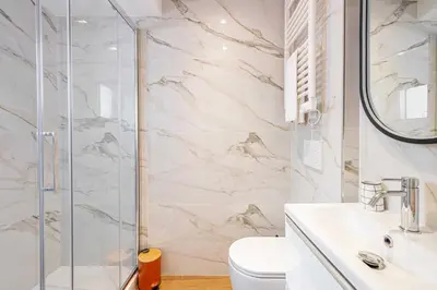 a bathroom with a shower and a toilet and a sink at Charming apartment - Near the Old Port and Suquet in Cannes