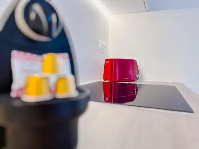 a pair of shoes sitting on a counter next to a red object at Le Cannes Mélodie - Terrasse in Cannes