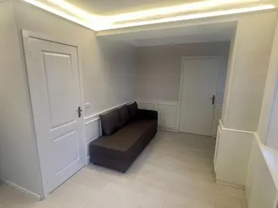 a living room with a couch and a ceiling at La Brise by Connexion in Cannes