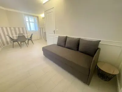 a living room with a couch and a table at La Brise by Connexion in Cannes