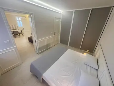 a small bedroom with a bed in a room at La Brise by Connexion in Cannes