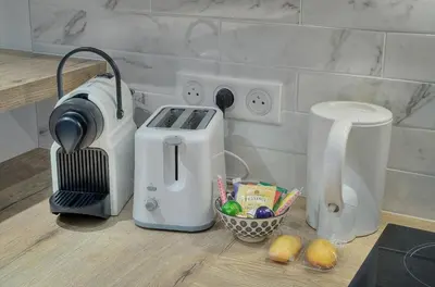 a kitchen counter with a toaster and a food processor at TOP renovated 1 bedroom near Palais 2P1 by RIVAEVENT in Cannes