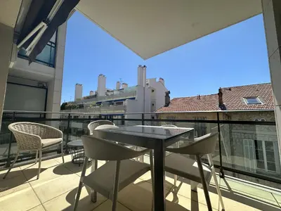 a balcony with a table and chairs and a view at Appartement centre ville 7 Lecerf in Cannes