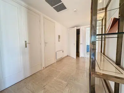 an empty hallway with white walls and a glass floor at 78m2 Terrasse vue mer à 50m de la Croisette in Cannes
