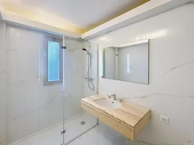 a bathroom with a sink and a shower at 78m2 Terrasse vue mer à 50m de la Croisette in Cannes