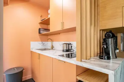 a kitchen with a counter with a coffee maker on it at Sublime studio in the center of Cannes in Cannes